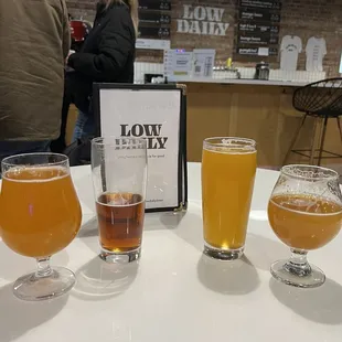 three glasses of beer on a table