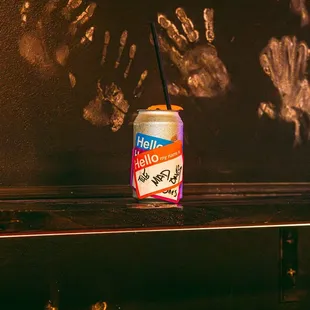 a can of soda on a shelf