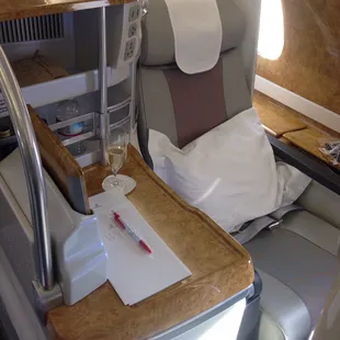 Emirates business class seat on Airbus A380, converts to lie flat bad and every seat has its own aisle.