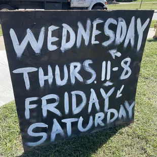 ows a sign that reads wednesday thru friday saturday