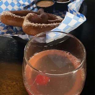 Champagne cocktail and soft pretzel
