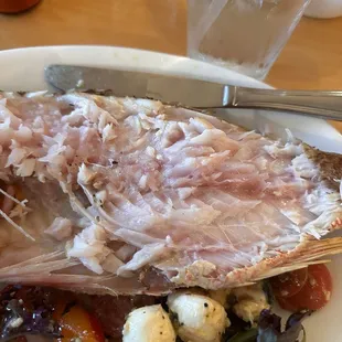 Cooked whole fish. Or at least what wasn't cooked. Both sides were the same and consistent at least