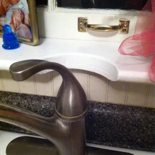Half moon cut out so faucet would work