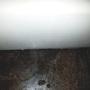 Tile work where grout is breaking apart along tub.