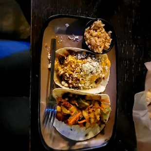 a plate of tacos and rice