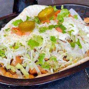 Lowrider Taco.  Get a little extra salsa, start with a fork, then roll it up in the 8 inch corn tortilla.