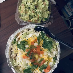 Chicken taco salad with a side of guacamole and chips (chips aren&apos;t pictured and weren&apos;t eaten). Highly recommend this delicious combo!