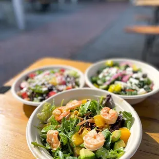 two bowls of salad with shrimp