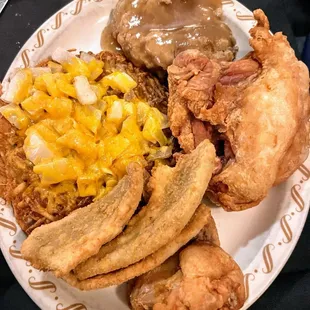 Surf n turf: perch, broasted chicken, stuffing, crispy hash browns with cheese and onions.