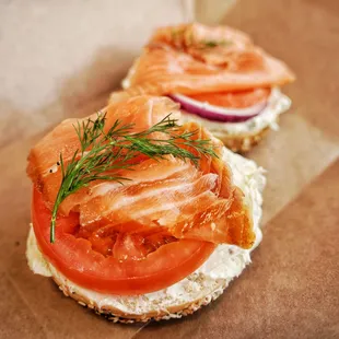 Loxsmith, cold smoked salmon, chive cream cheese, tomato onion dill on a everything bagel