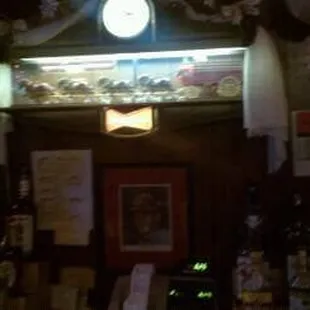 a clock on the wall above the bar