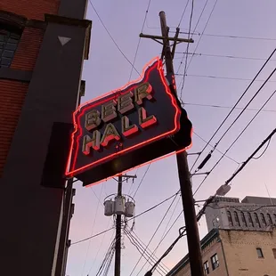 a neon sign for a beer bar