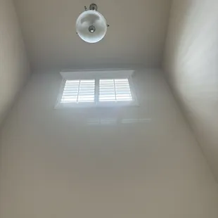 Second story wooden shutters.