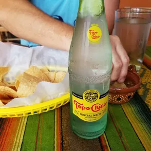 Complimentary chips & salsa and an ice cold Topo Chico.