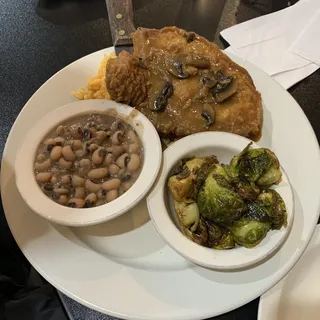 Smothered Pork Chops over rice dinner