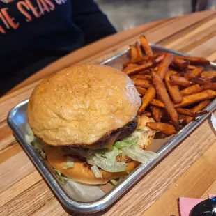 a plate of fries and a tray of fries