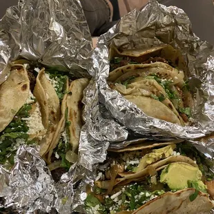 three tacos wrapped in foil