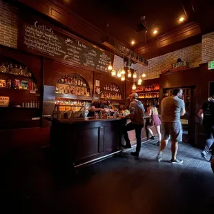 people standing at the bar