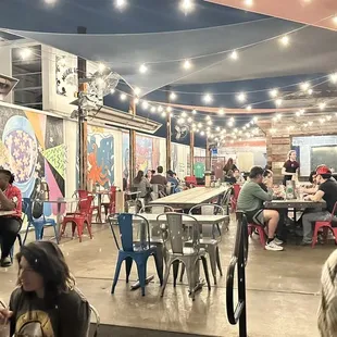 a large group of people sitting at tables