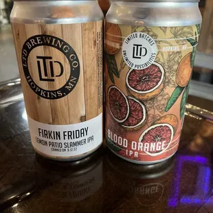 two cans of frokiin friday blood orange