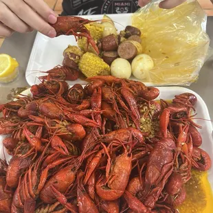 Fresh Boiled Crawfish, regular (mild) cajun garlic butter, an order of boiled eggs, sausage, corn