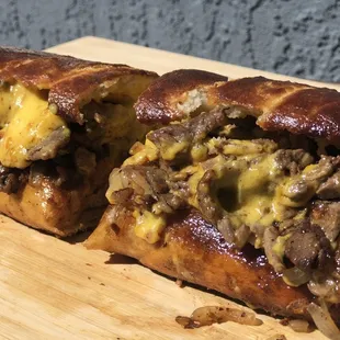 Cheesesteak Sub: Tender/Juicy Steak with onions &amp; homemade cheese whiz (none of that canned stuff).