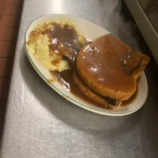 This is a roast beef sandwich with mashed potatoes and gravy. Oh my God awesome.