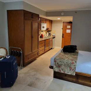 Nicely furnished suite with kitchen. Simple bed setup.