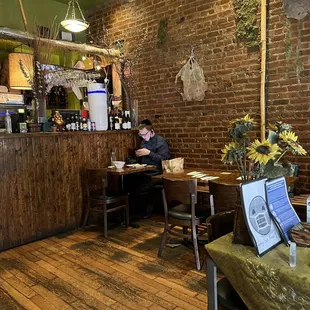 a man sitting at a table in a restaurant