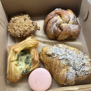 Oatmeal cookie, cinnamon roll, macaron, almond croissant, spinach croissant