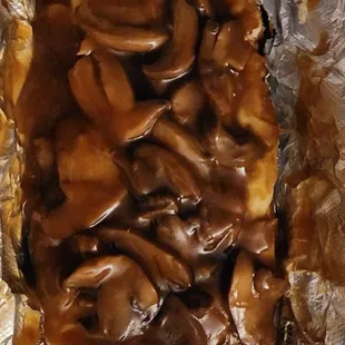 a piece of food wrapped in foil