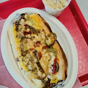 Famous lubi with macaroni salad - sandwhich packed fresh meat flavor, and all the delicious sauce/condiments!