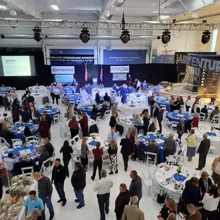 a large group of people at tables