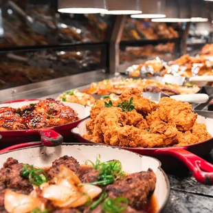 a variety of food on a buffet