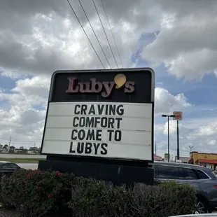 a sign in front of a restaurant