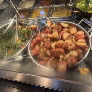 a variety of food items in a buffet