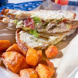 a sandwich and sweet potatoes