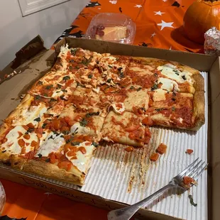 a pizza in a cardboard box