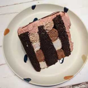 Why yes, a piece of chocolate cake, please, with pink buttercream frosting.