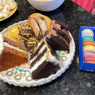 Chocolate coconut macaroons, assortment of cakes &amp; macarons, lemon cookies, cannolis