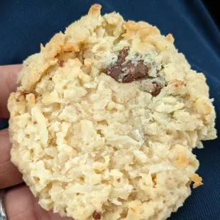 a hand holding a cookie