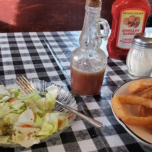 Salad with homemade dressing and onion rings