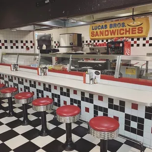 Old school diner bar featuring the original Lucas Bros. Sign