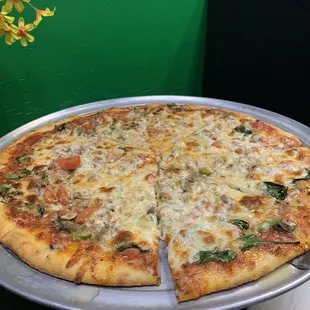 Veggie pizza with ground beef (which tastes like mild Italian sausage).