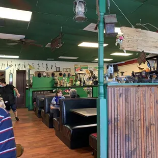 Part of the main dining area. There are both tables and booths.