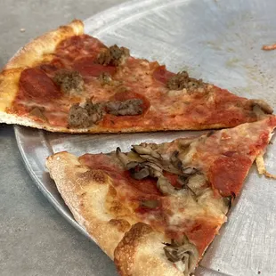Pepperoni and sausage pizza by the slice