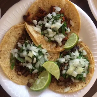 1 taco al pastor and 2 carne asadas