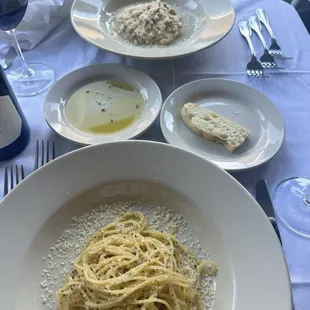 Cracked pepper spaghetti and risotto in the back