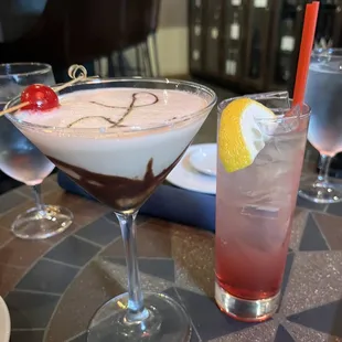 two cocktails on a table