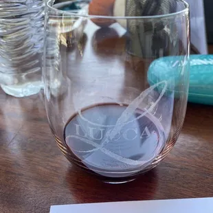 a glass of wine on a table